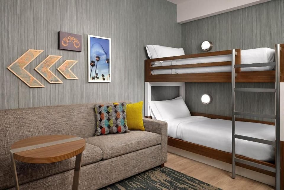 Stretch out together with fun bunks and a comfy lounge corner.