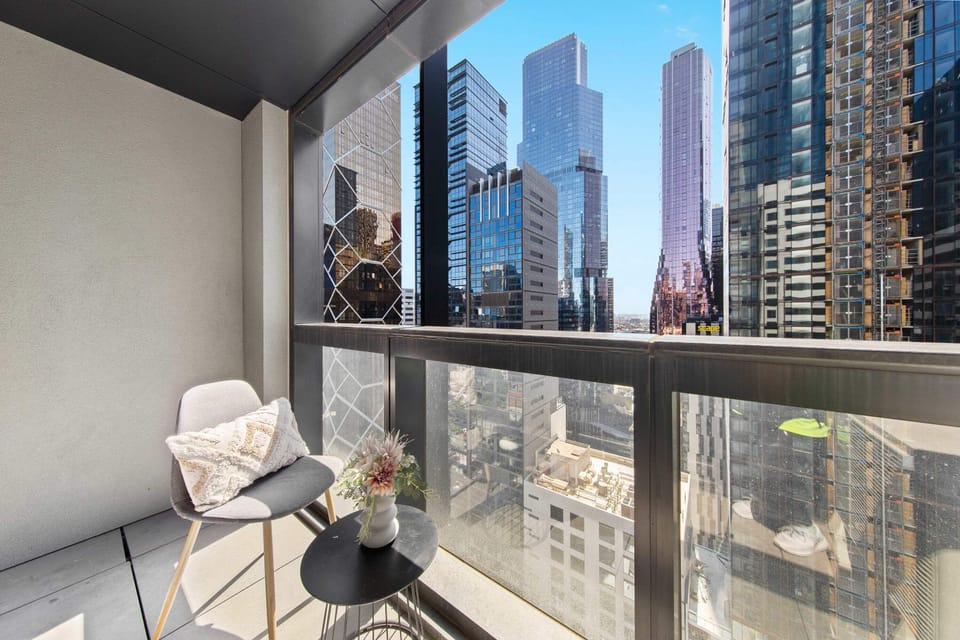 A private balcony with city views. (*Chair is from the dining area).