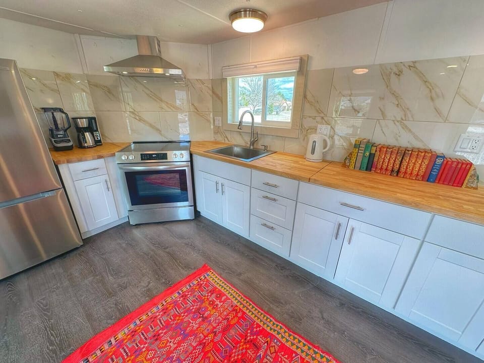 Great little kitchen with all new cabinets, butcher block counters and.... new everything.