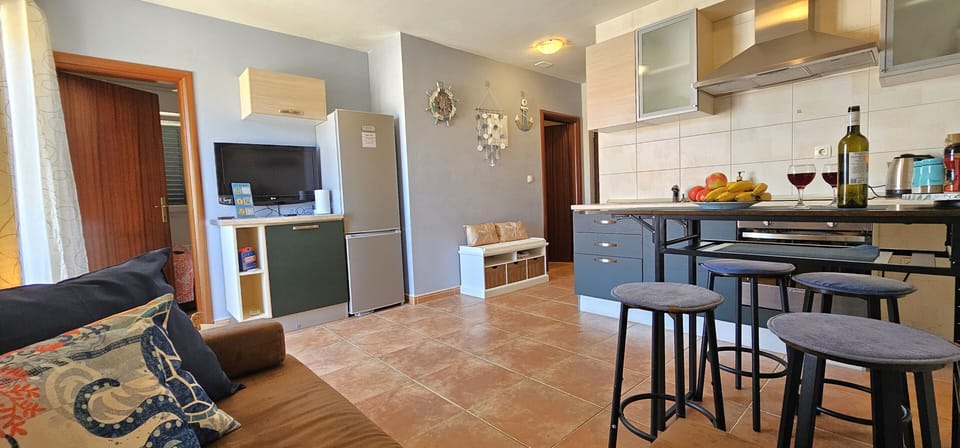 Open plan living dining room with full kitchen