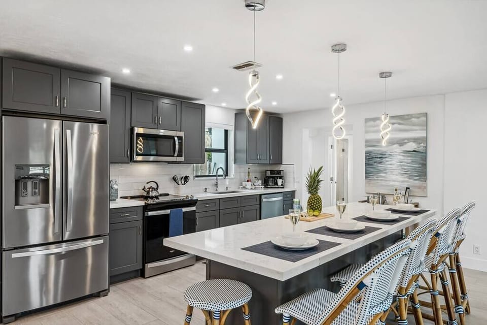 Featuring a modern kitchen where form and function seamlessly combine, making culinary dreams come true