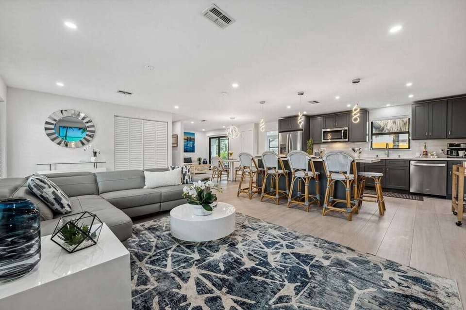 The beauty of an open floor plan, where spaces flow effortlessly into one another, creating a sense of spaciousness and togetherness.