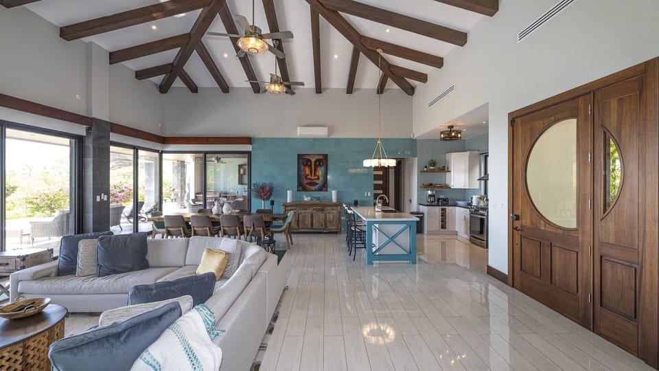 The tropical and stylish decor of the villa flows through the open concept interior living space.