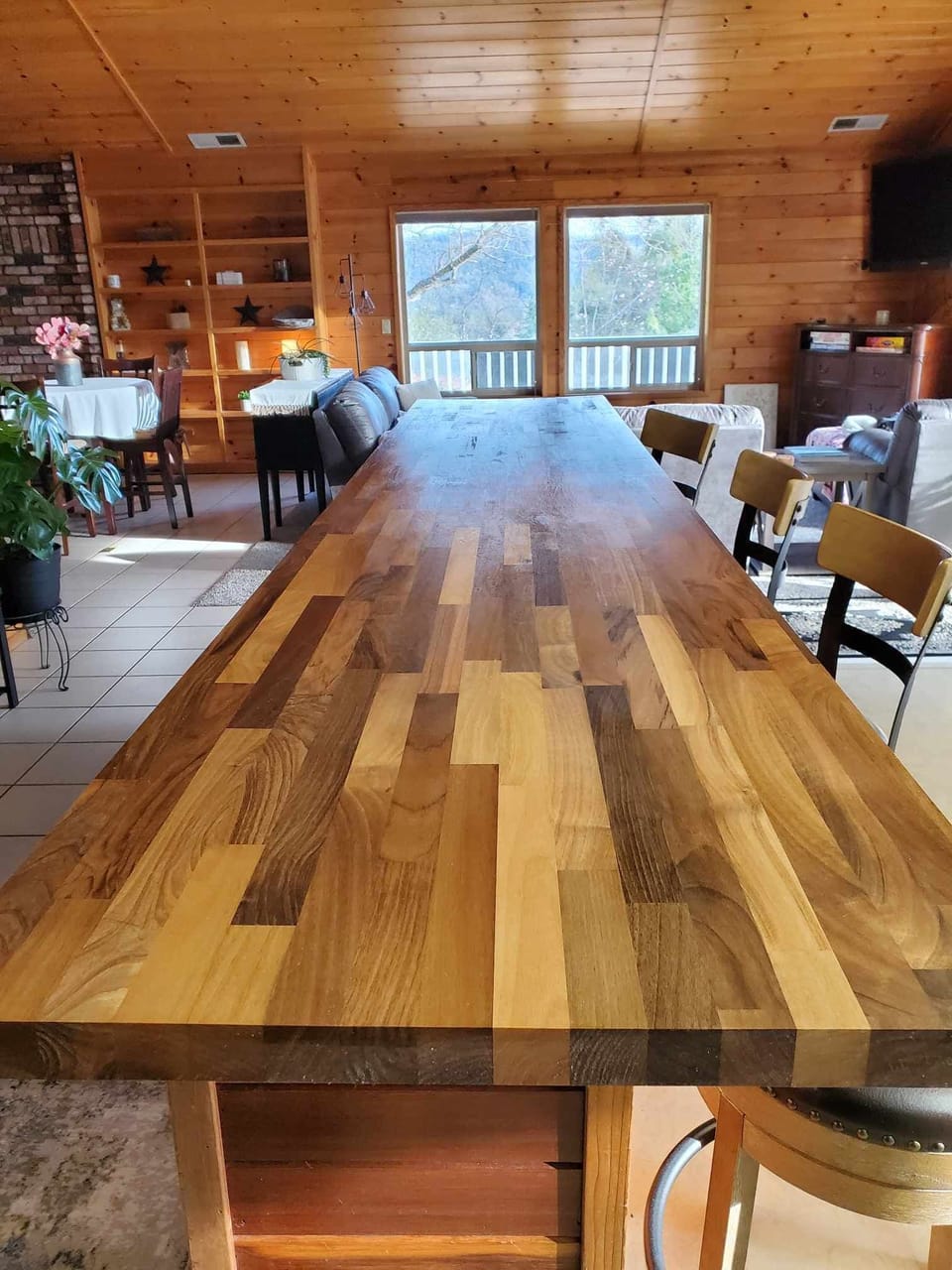 10 foot butcher block island with 4 bar stool seats.