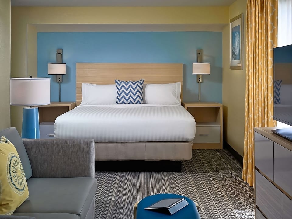 Sink into crisp linens and enjoy a calm, modern retreat.