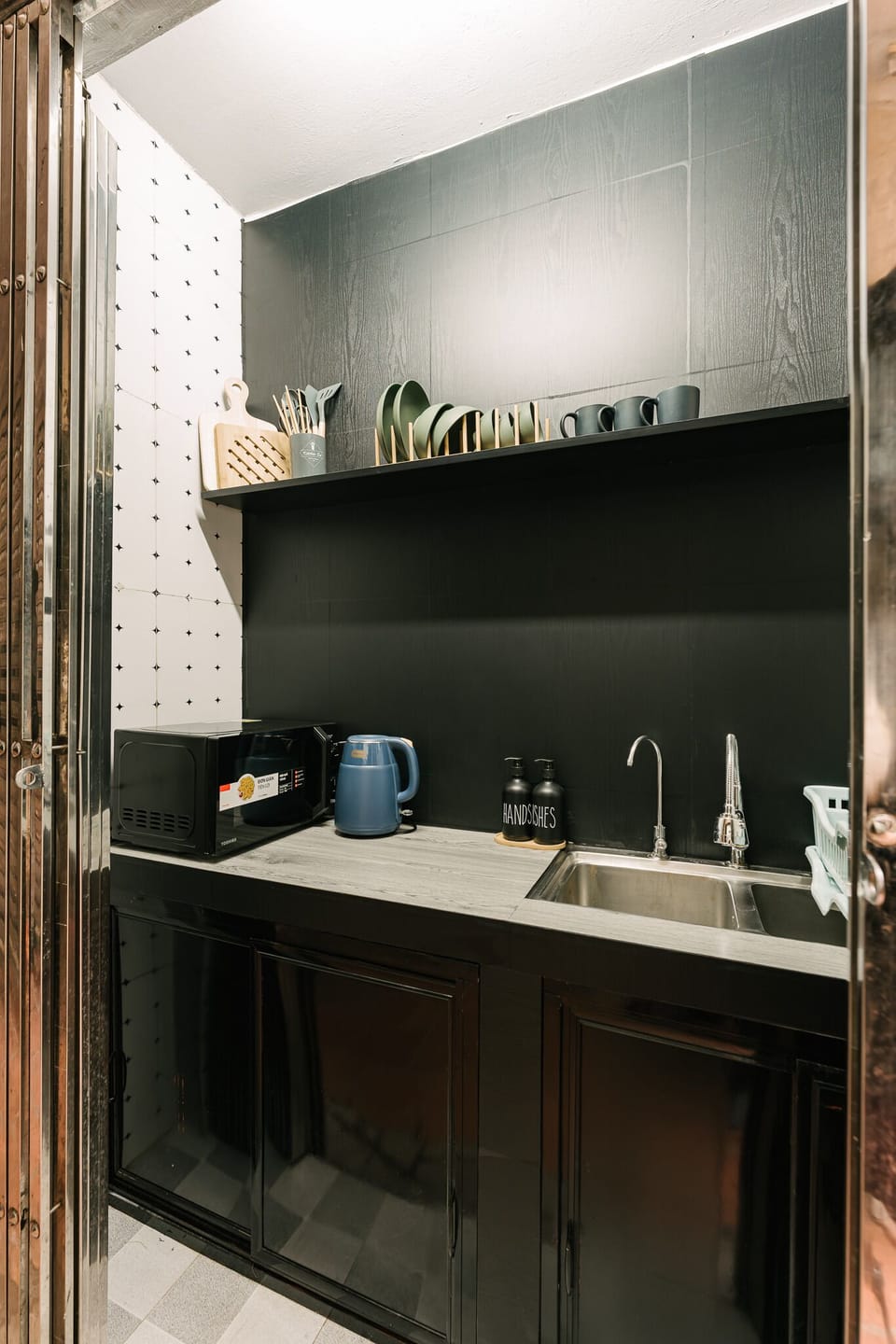 Kitchen is located outside living space. 