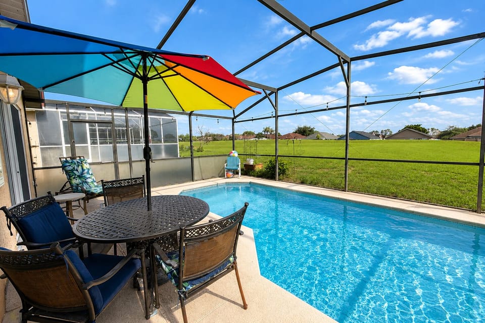 Eat poolside with patio dining table right next to the pool.