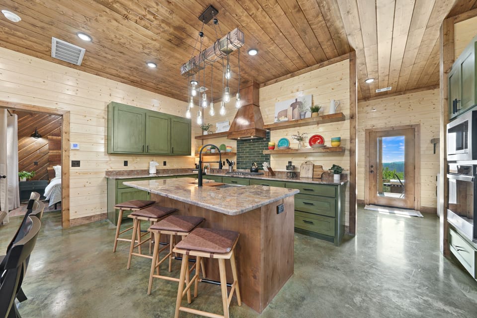 The barstool seating at the kitchen island is a sweet spot for sipping beverages and enjoying breakfast,  lunch, or a snack.