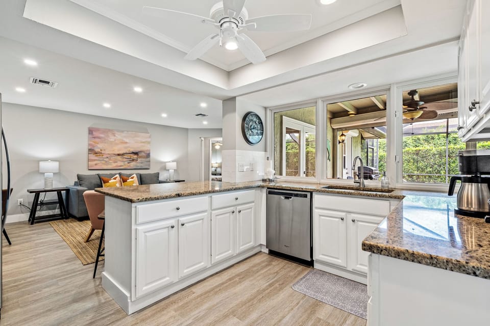 Bright, open kitchen with plenty of prep space and bar seating