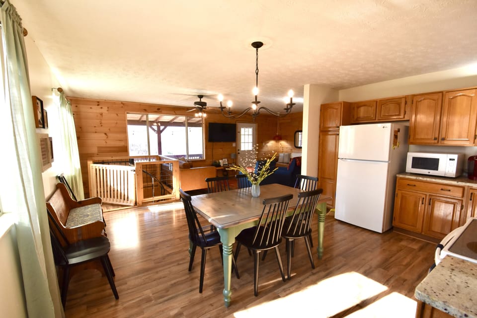 Plenty of seating for everyone.  Kitchen is open to living and staircase.