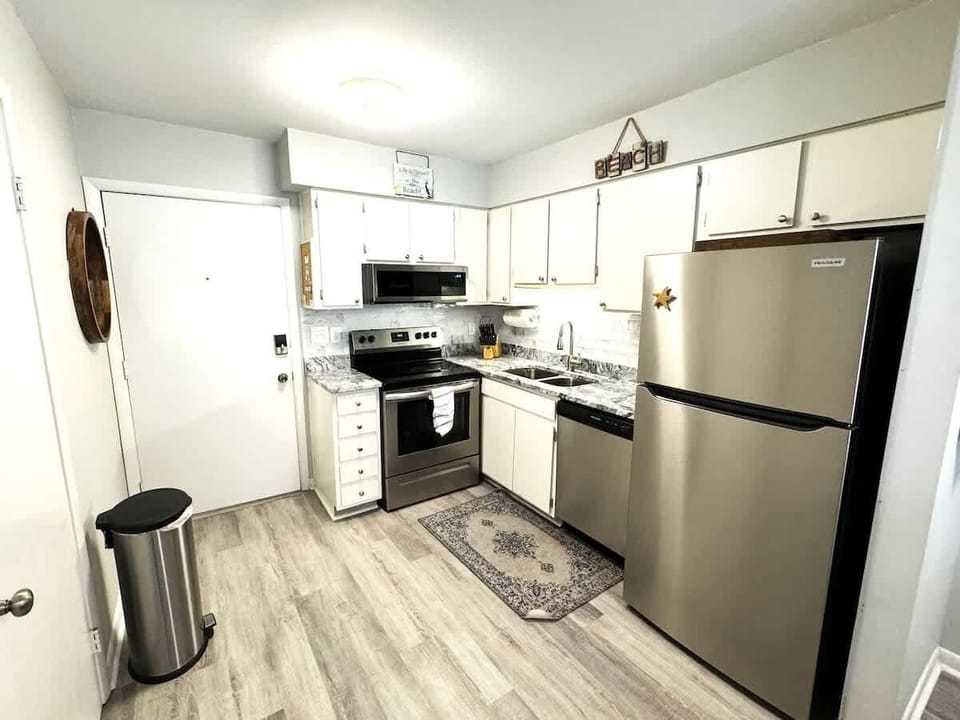 The space is finished with light-toned, wood-plank flooring.