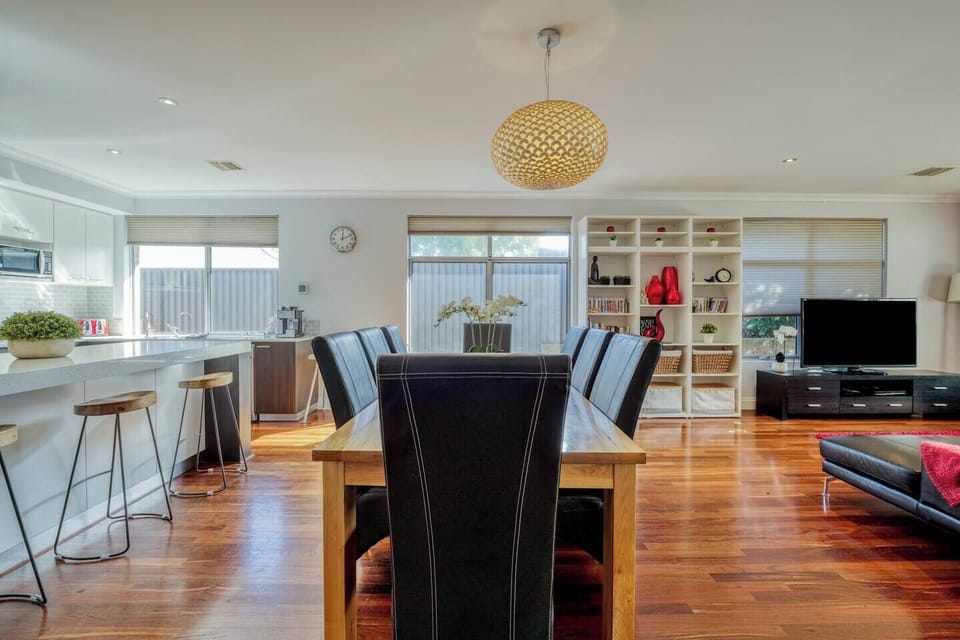 There is a large dining table that fits 8+ and is perfect for shared meals at home.
