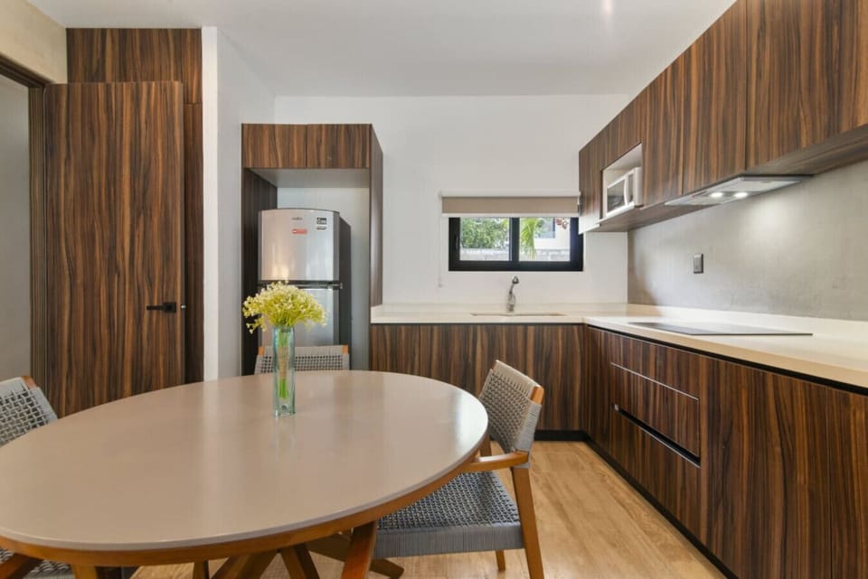 Our kitchen offers ample counters and new appliances for cooking meals.