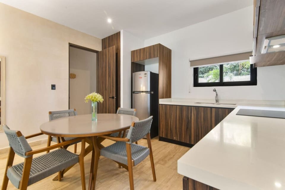 Bright kitchen and dining area with a clean design, perfect for meals.