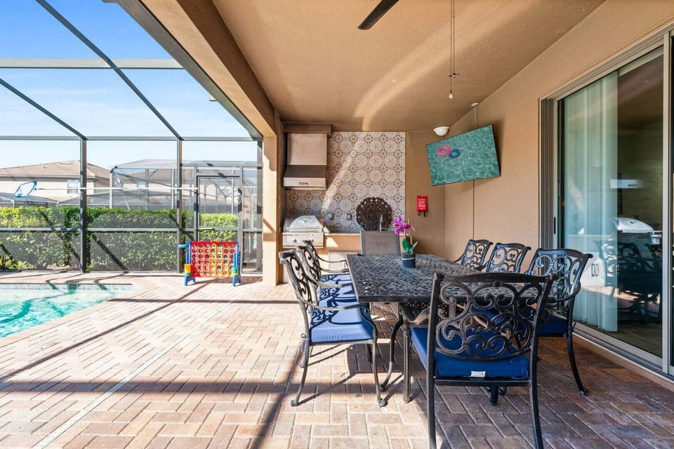 The outdoor dining area features a table that comfortably seats 8 people