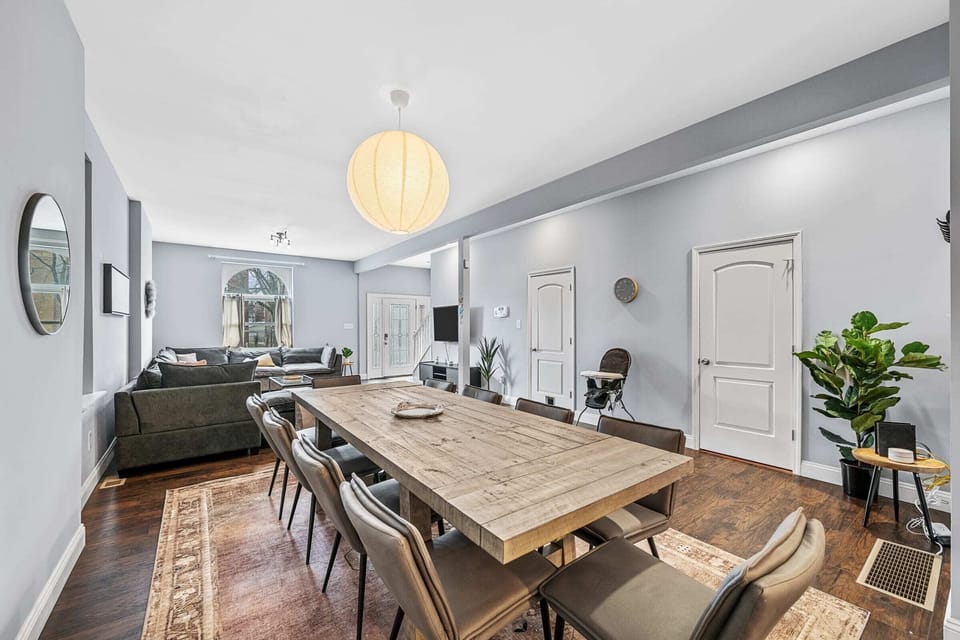 The spacious dining area with a gorgeous farmhouse table seating 10 guests!