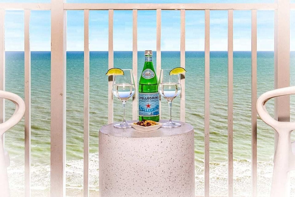 Enjoy a refreshing drink on your balcony, overlooking the waves. 