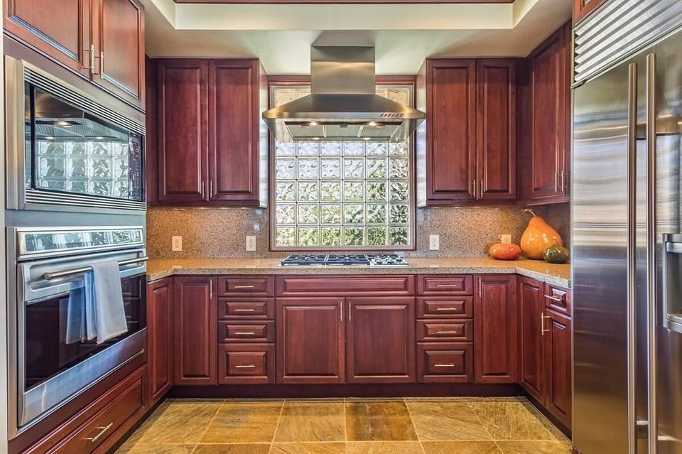 Gourmet kitchen with subzero and wolf appliances and gas cooktop.