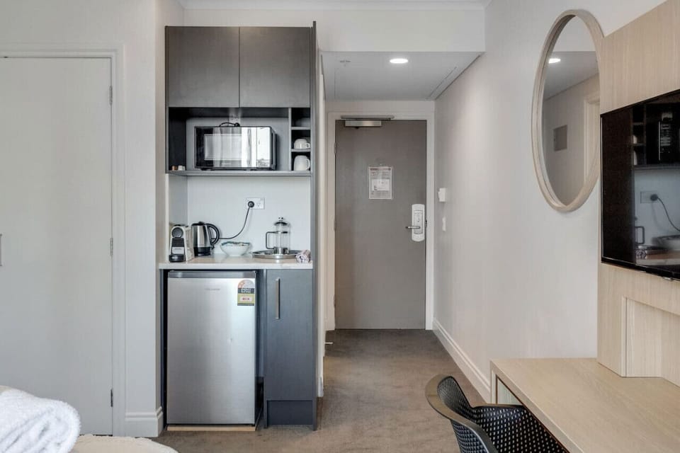 The kitchenette has a mini-fridge, microwave, kettle and Nespresso machine.
