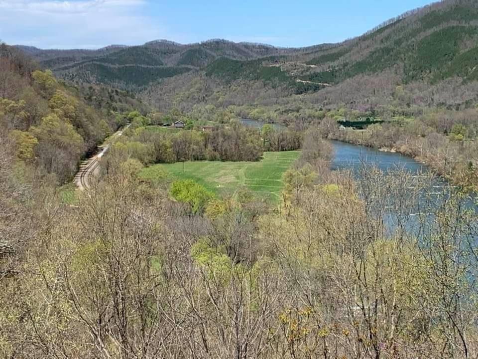 Aerial view of the large property that the Limestone cabin sits on. You do have to take a short walk from the cabin to access the large field and river frontage on the French Broad River. 