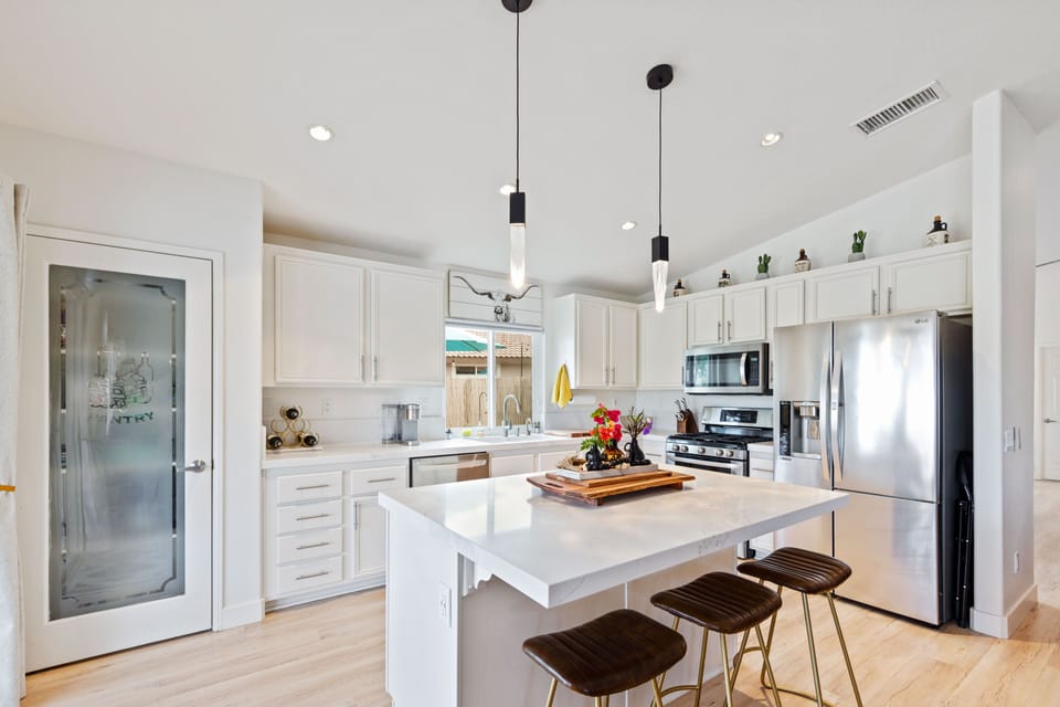 Island seating for 3 and kitchen