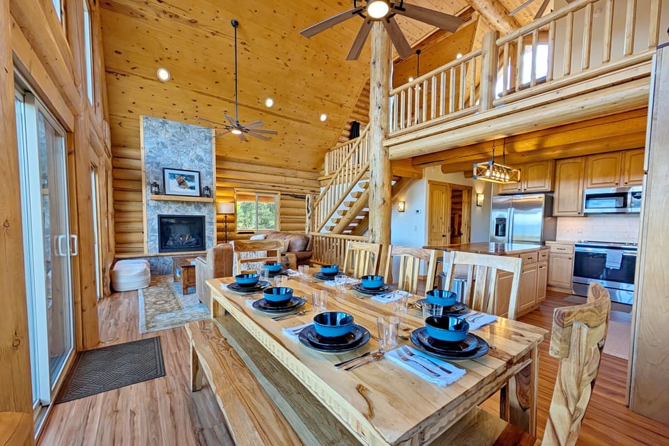 Dining room table seats 8 with additional seating at the kitchen island