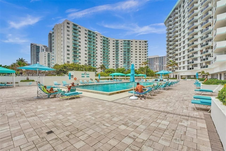 View of pool and property