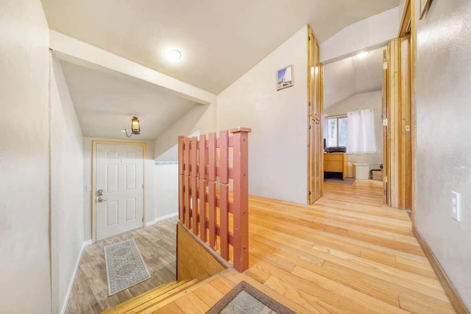 door to private dedicated office space on right and staircase to back exit and lower laundry area