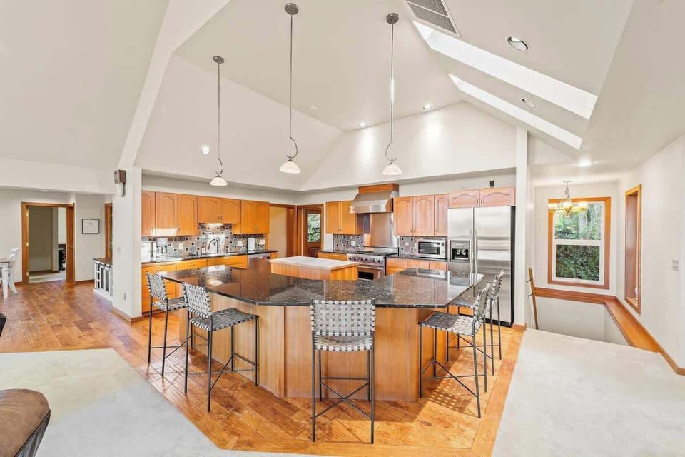 Gourmet kitchen with prep space and stools. Cook together or enjoy a snack.