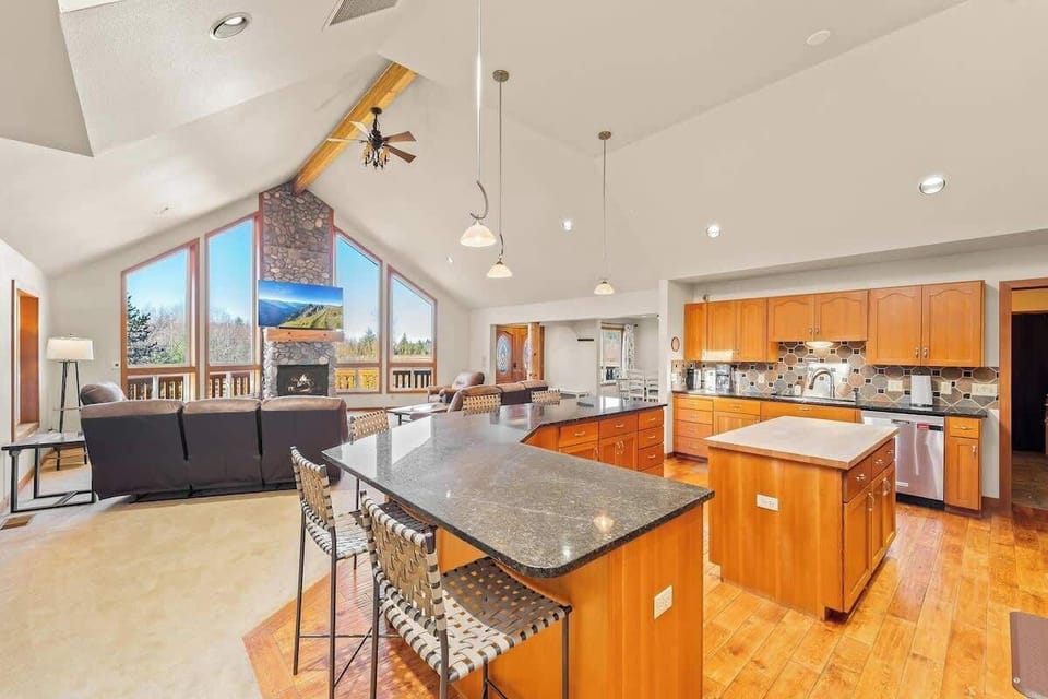 Open-concept living with vaulted ceilings. Easy to cook and hang out all in one space.