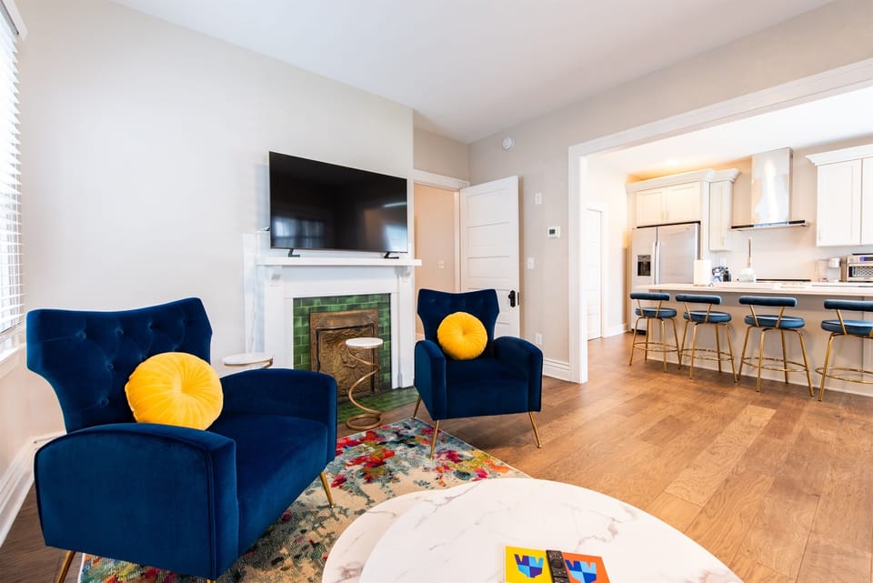 Comprehensive kitchen view, highlighting the seamless flow into the living area, ideal for socializing while cooking.