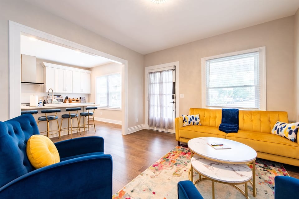 View from the kitchen shows a well-appointed living room with ample space for relaxation and social gatherings.