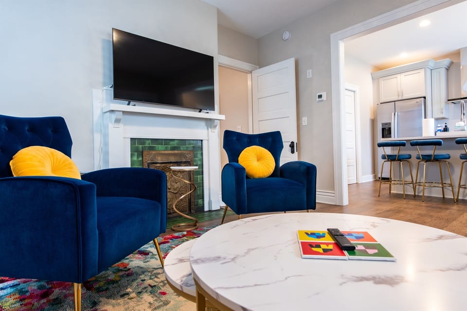 A closer look at the living area highlighting the chic decor and natural light that enhance the room's appeal.