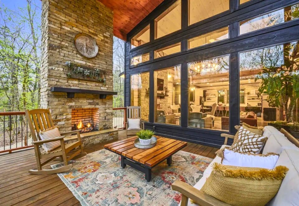 Cozy up fireside on the porch of your dreams. Our lodge blends the comfort of home with the peace of the great outdoors!