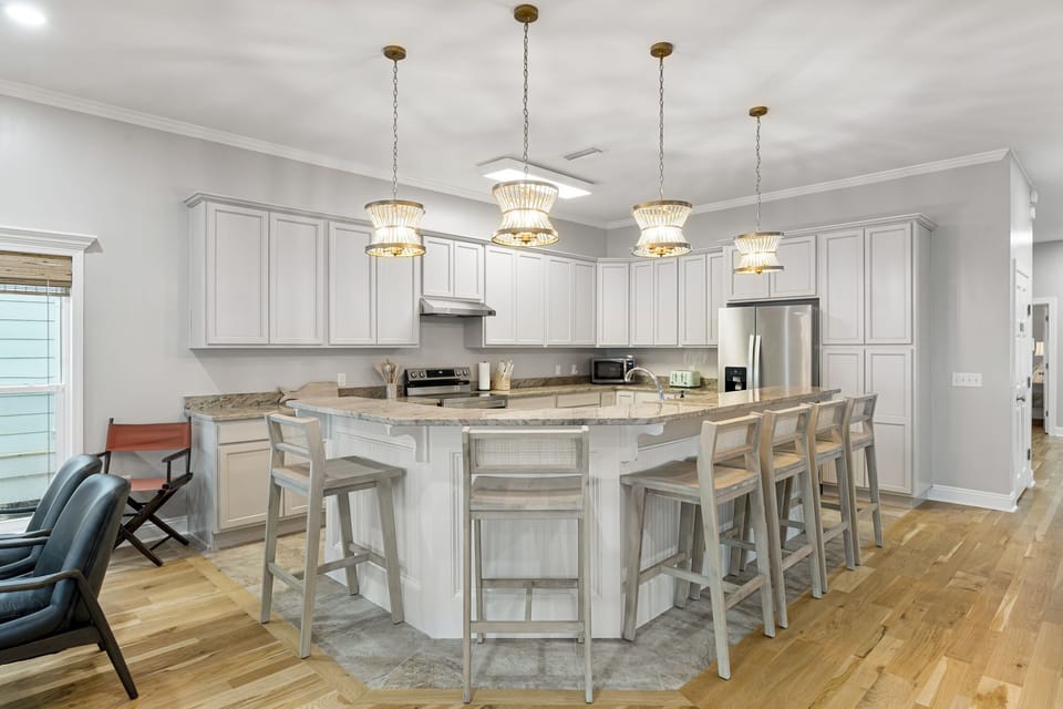 The bar area has 6 bar stools for additional seating, so the cook is never left out of the conversation.