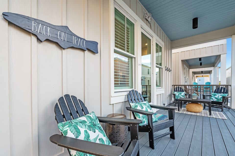 Relax and enjoy the gulf breeze on this spacious patio with ample seating