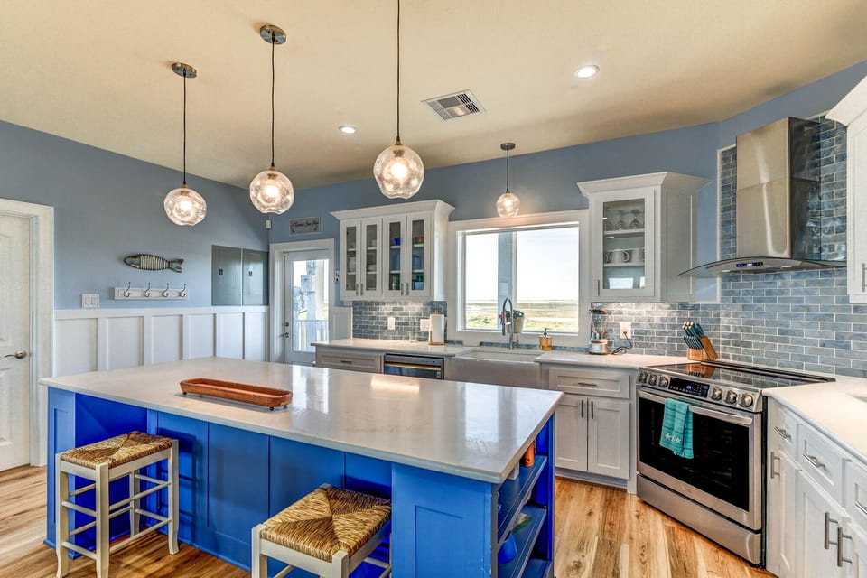 Kitchen Area has an eight foot bar for serving buffet and extra seating