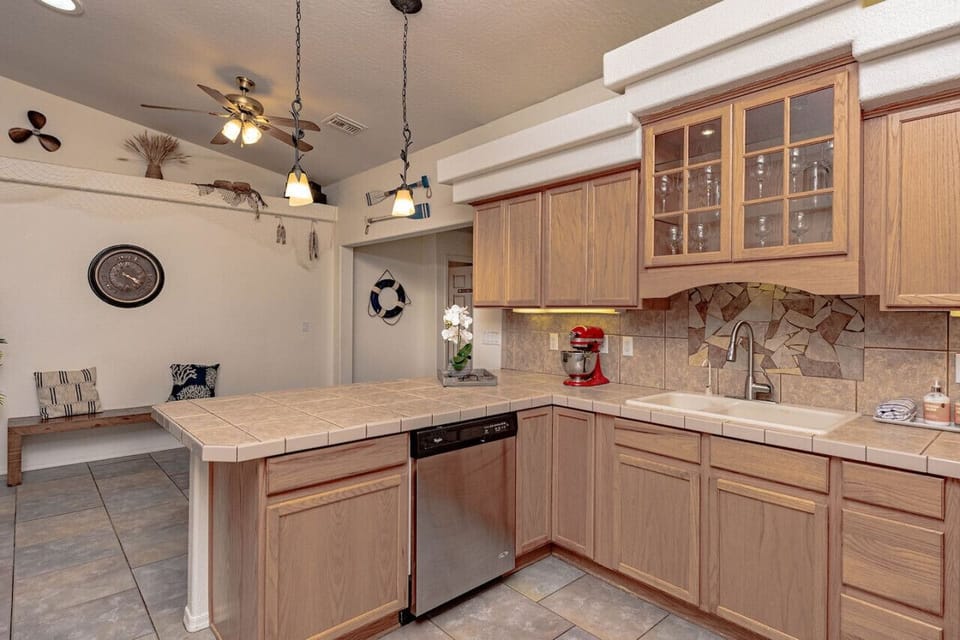 Kitchen Fully Stocked to Serve Large Gatherings (including roasters, crockpot, serving dishes, and full set of pans/dishes).