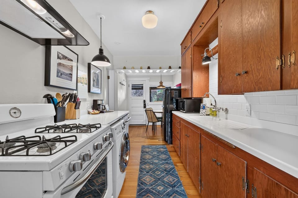 Fully furnished kitchen with all the expected appliances including a dishwasher, microwave and Smeg fridge