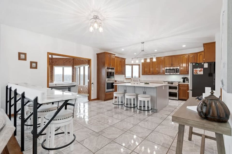 Kitchen, bar sitting area, and the entrance to one of the 180 degree panoramic view rooms