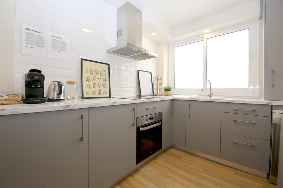 Modern open kitchen is fully fitted with all the appliances