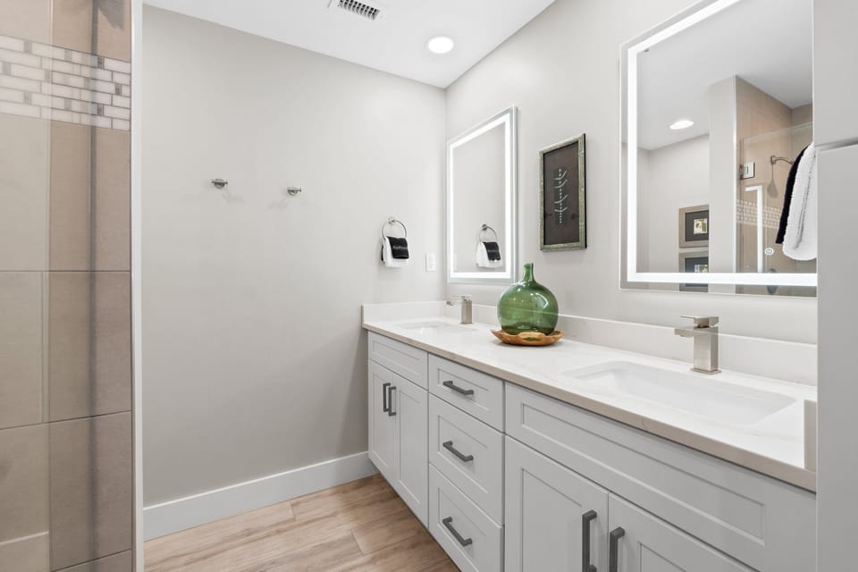 Master bath provides a double vanity, two lighted mirrors and plenty of cabinet storage for all your bathroom necessities.

Professionally Managed by
Breathe Easy Rentals