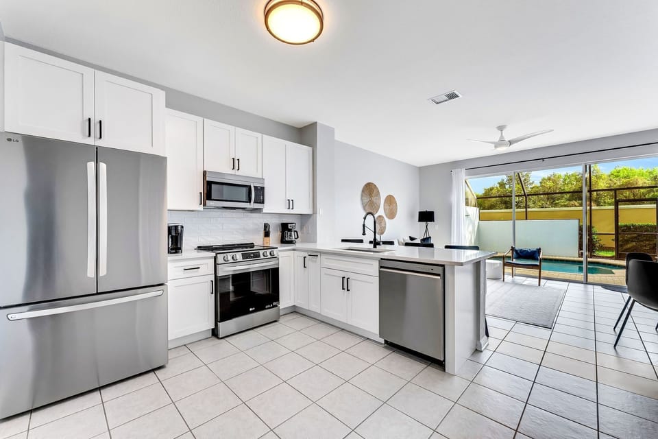 Open concept with view of the private lanai and splash pool from the kitchen
