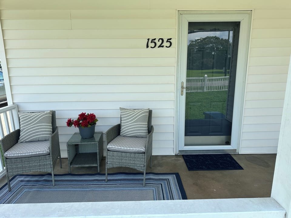 Covered front porch to enjoy the beautiful weather!