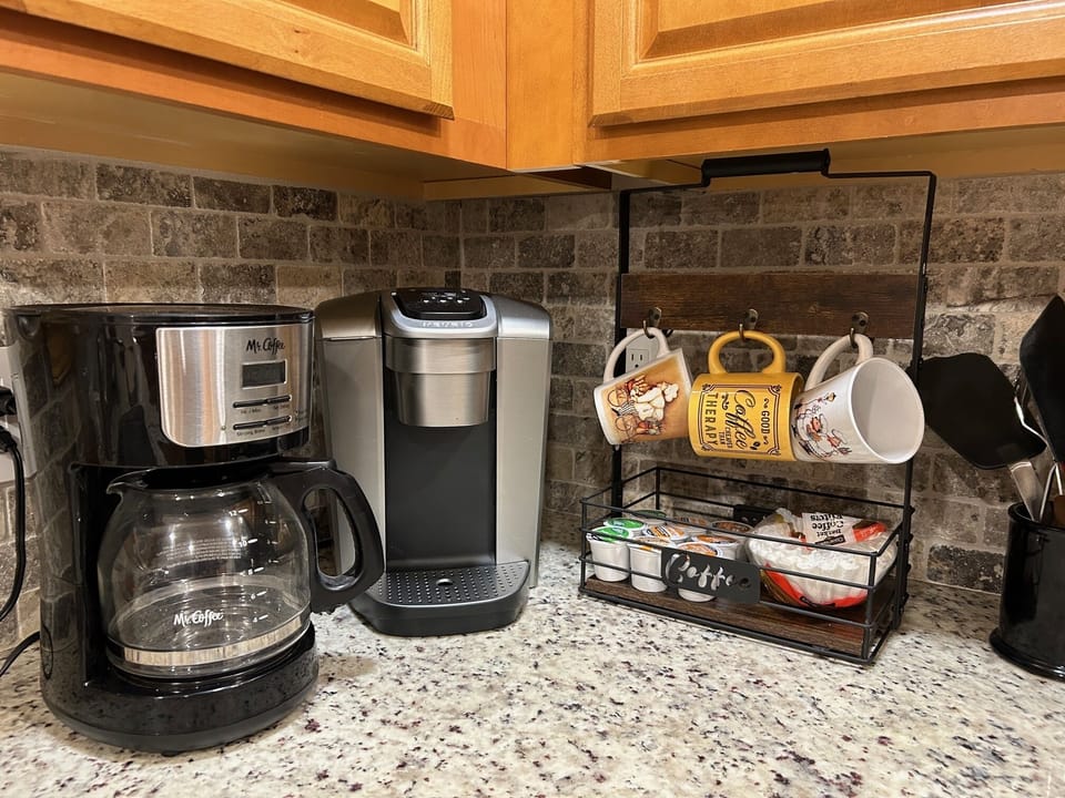 Coffee pot or keurig for your use, fully stocked with coffee, sugar, creamer