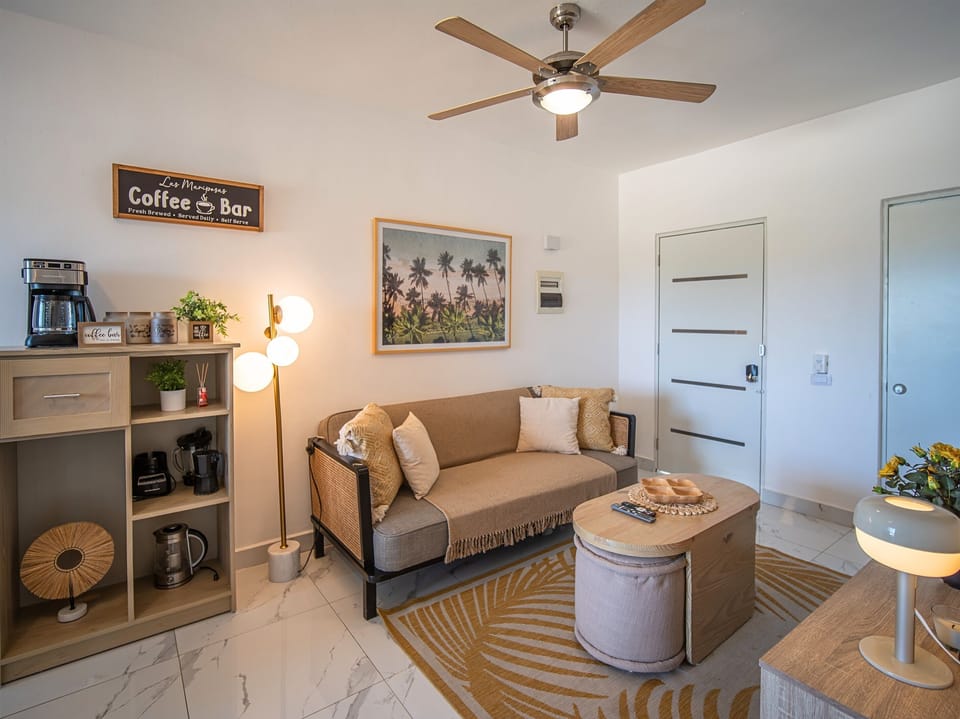 Living Room: Bright and inviting space with chic decor and a coffee bar for your morning rituals!