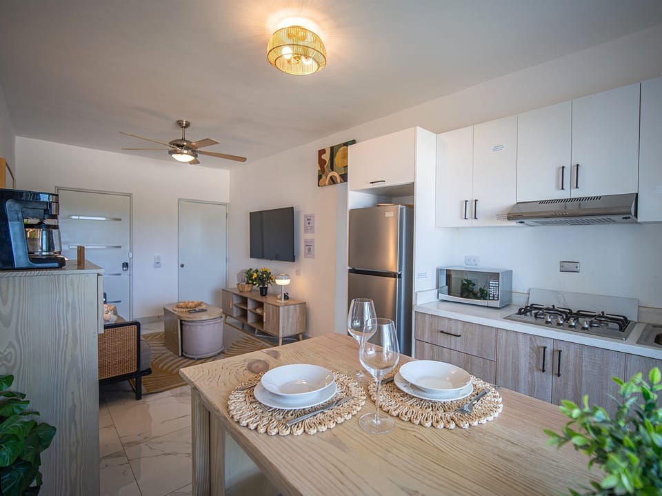 Dining Area: Bright space with modern decor, perfect for meals and laughter after beach adventures!