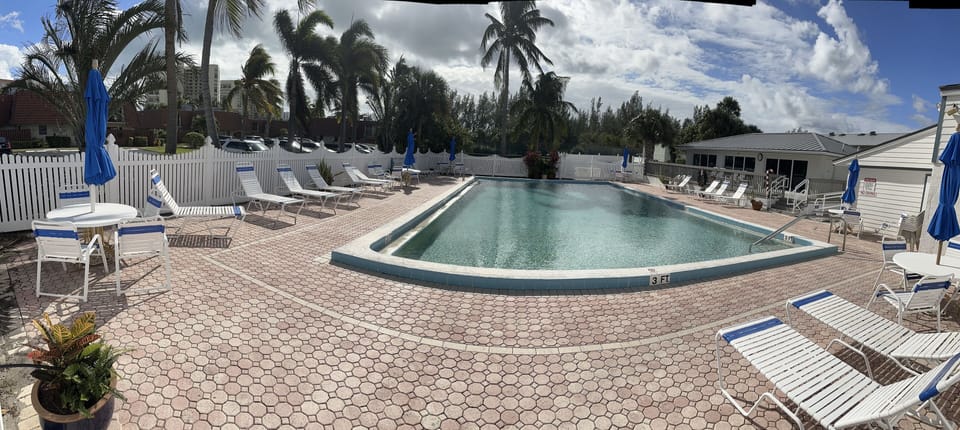 Community Pool & Clubhouse area with bathroom facilities & Tennis courts