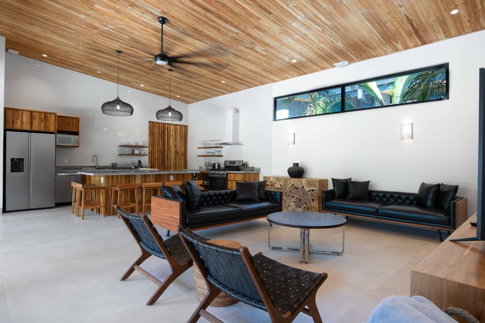 Chef kitchen with huge graite iseland seating overlooks family room with 70"TV