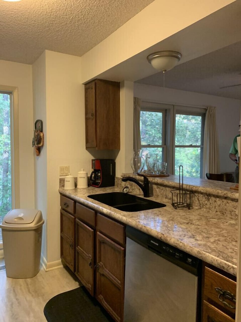 Bright kitchen with plenty of counter space — enjoy peaceful woodland views while you cook or sip your morning coffee.